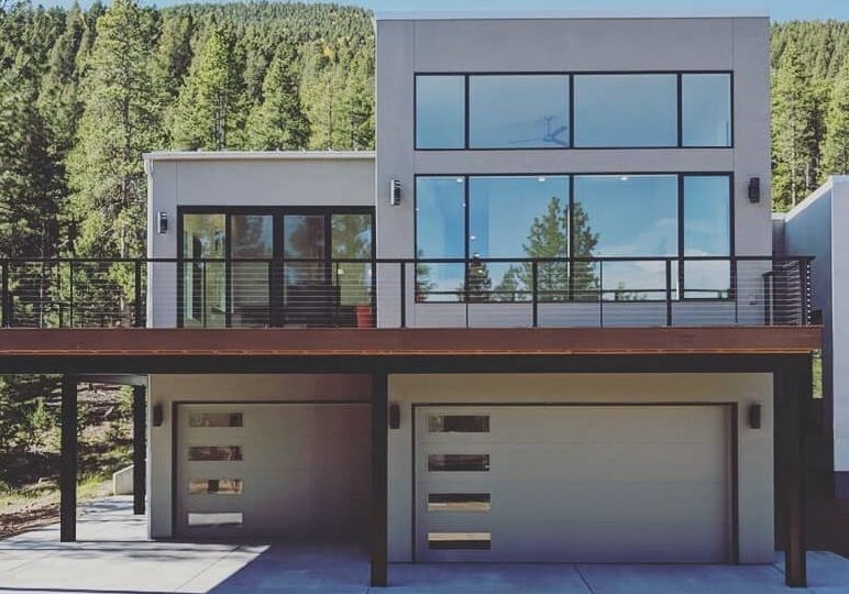Modern two-story home with garage and balcony